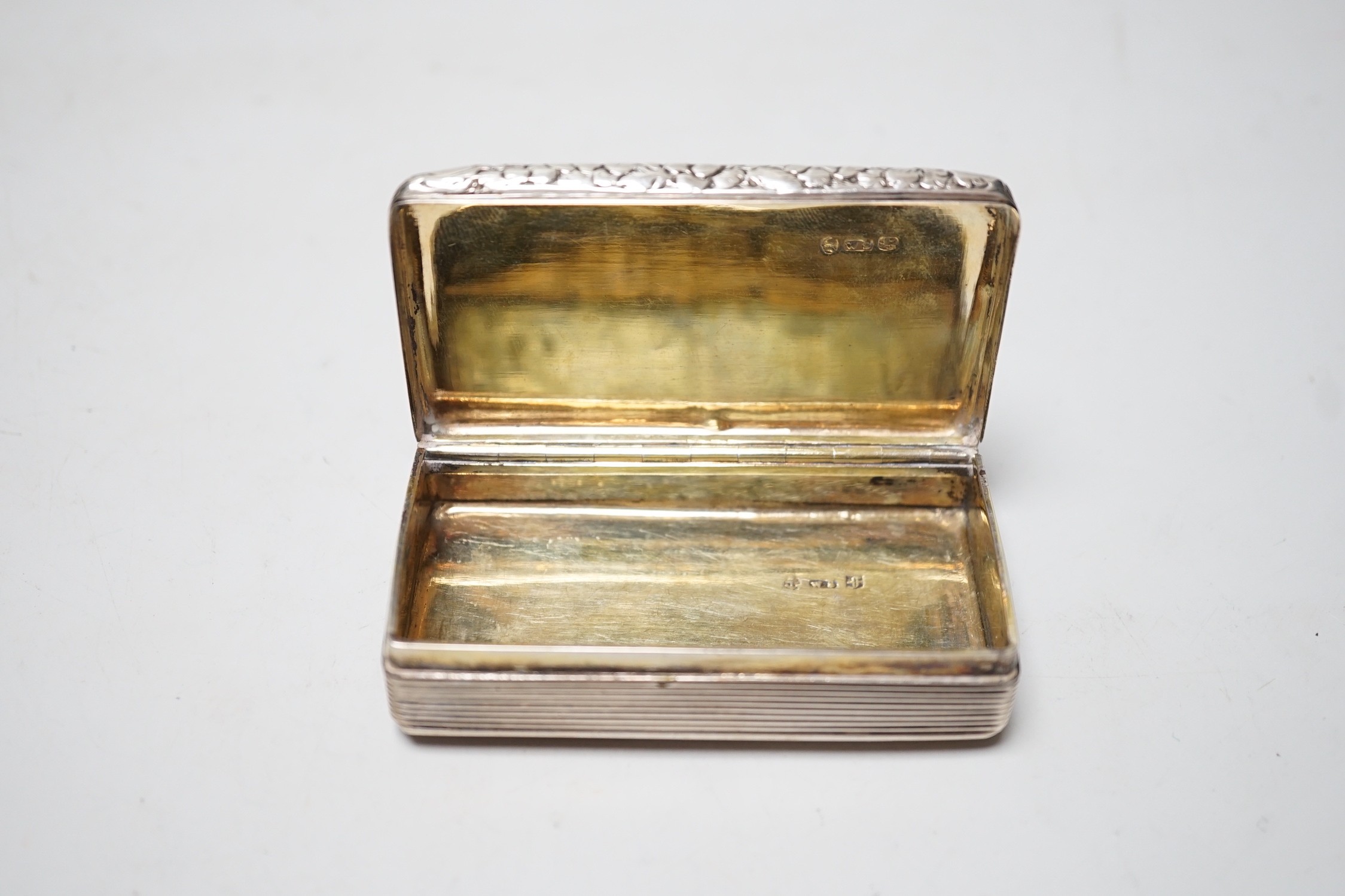 A late George IV engraved silver rectangular snuff box, with wriggle work decoration, William Simpson, Birmingham, 1829, 81mm.